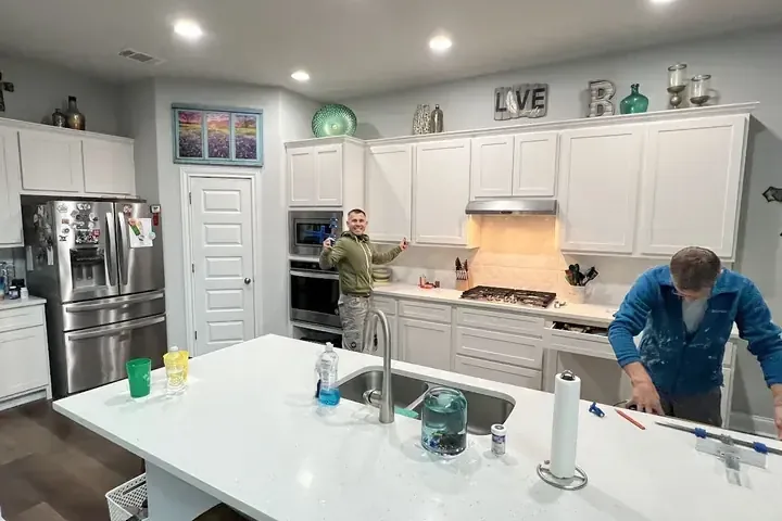 A kitchen being restored after a supply hose leak